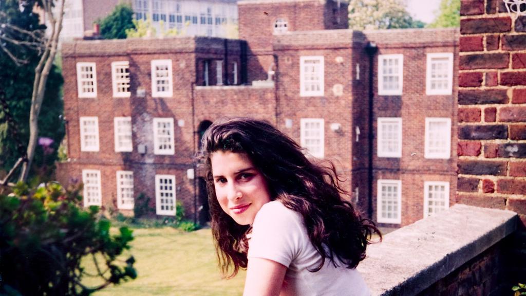 A-young-Amy-outside-her-NanO-Os-flat-in-Southgate-Photographer-unknown-c-The-Winehouse-Family.jpg